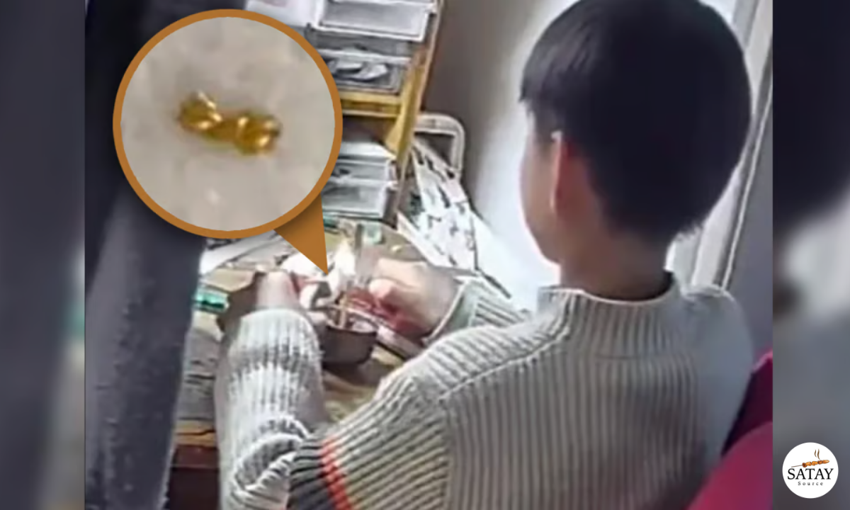 Child cutting gold necklace